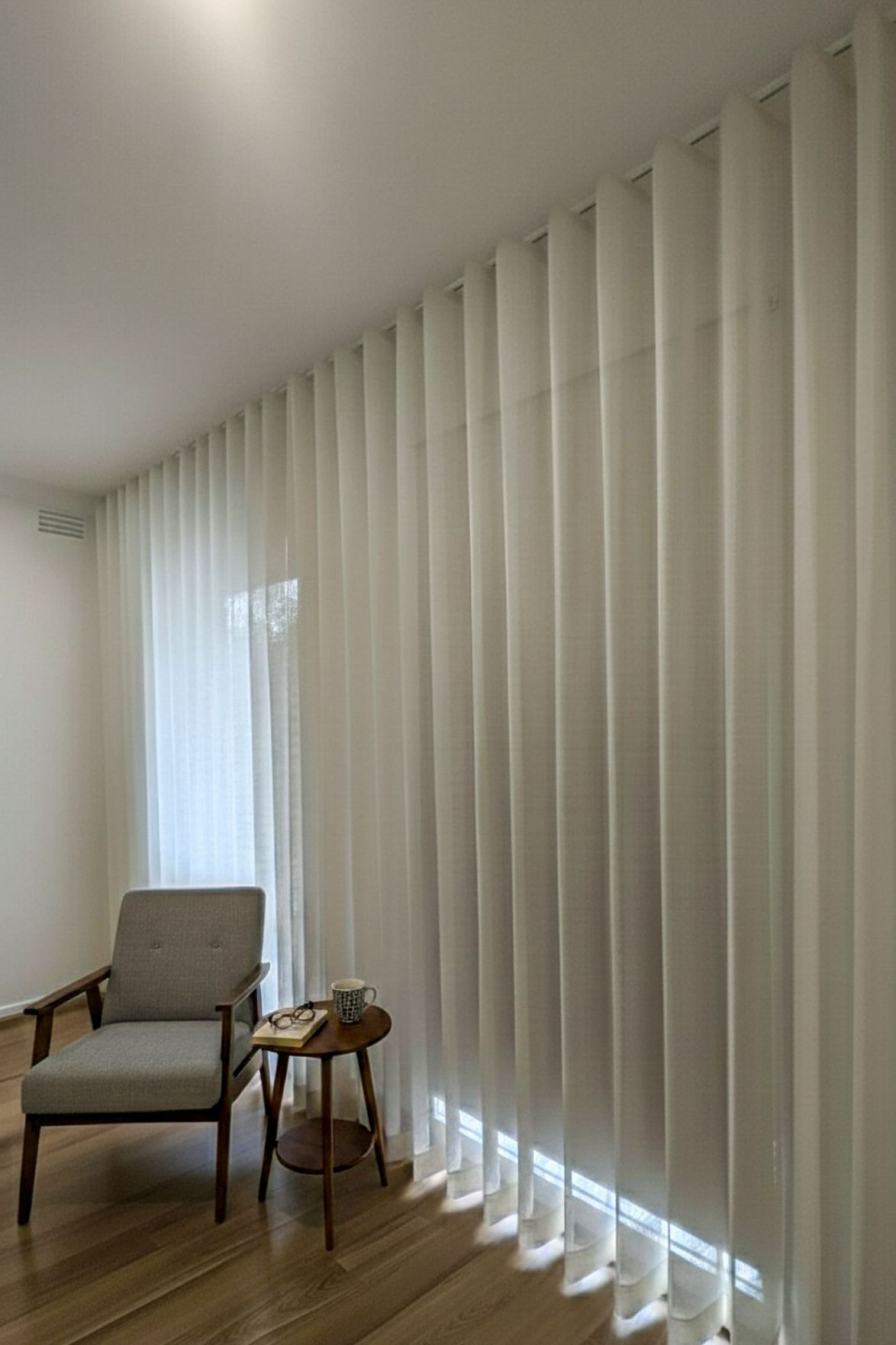 Modern living space upgraded with custom sheer curtains