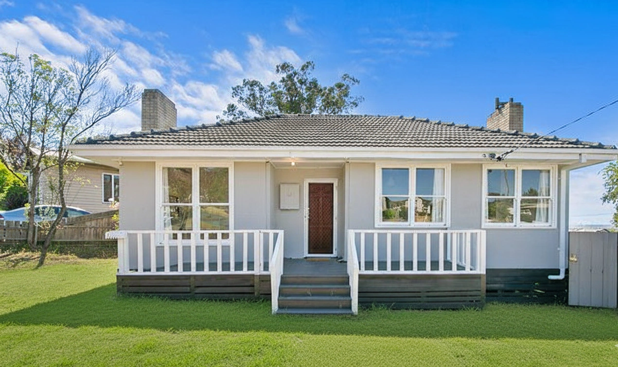 Affordable exterior home renovation with full repaint, new white balustrades and refreshed front steps to enhance curb appeal.