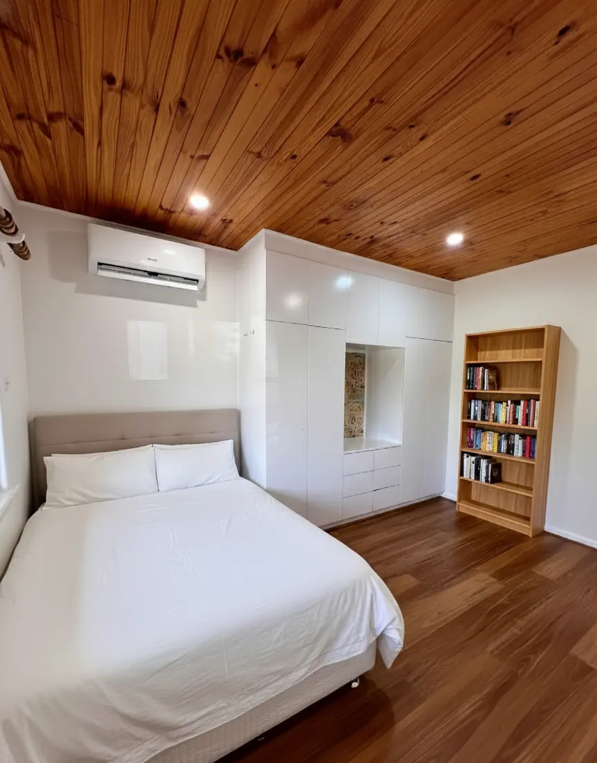 Bedroom with black oak hybrid flooring