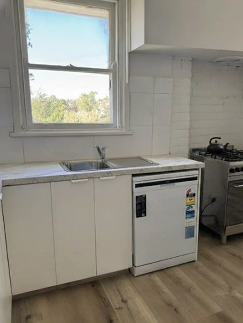 Fast kitchen renovation Morwell with white cabinetry and hybrid flooring.