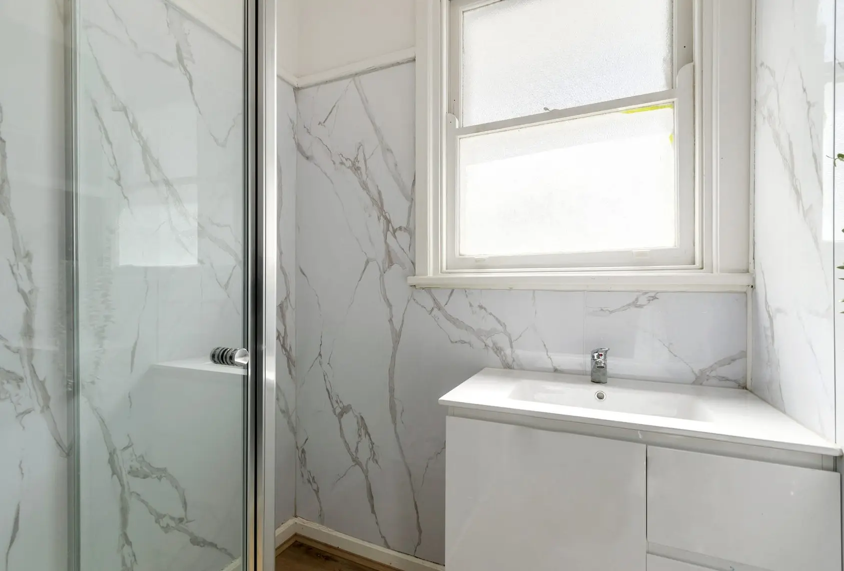 Low-cost bathroom makeover with quality fittings and clean contemporary styling.