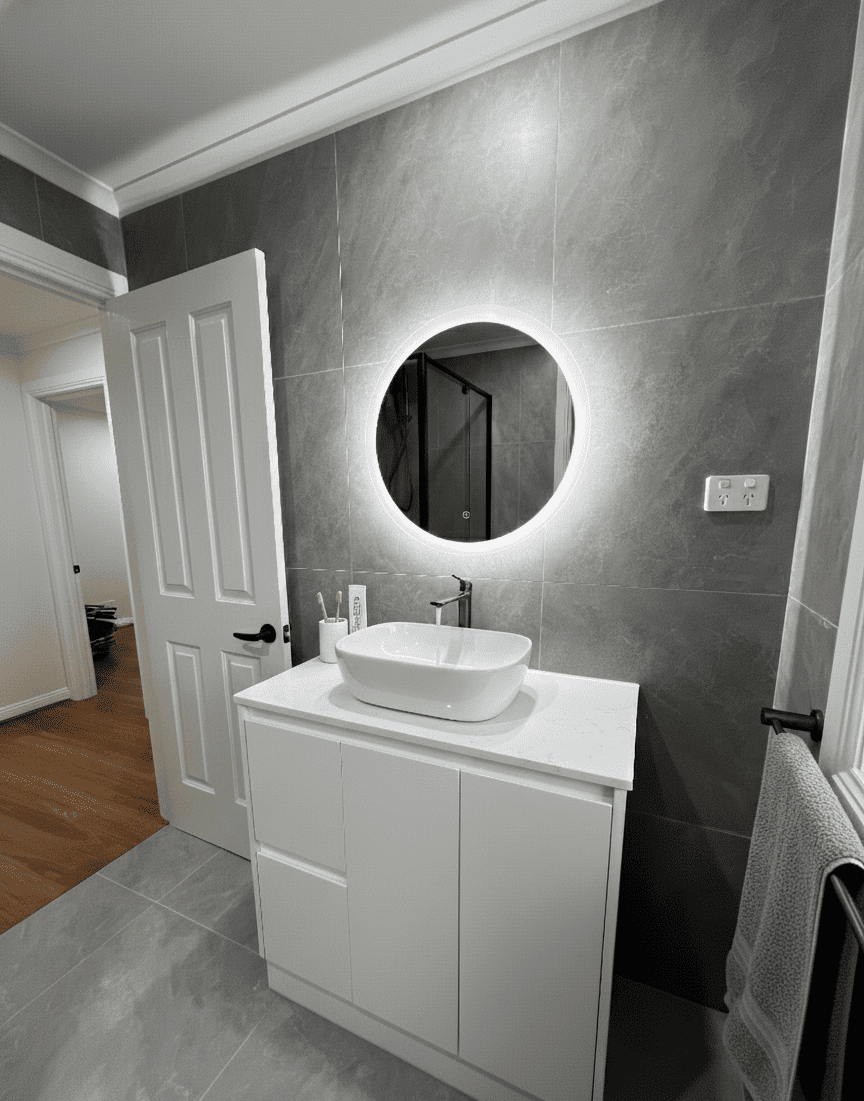 Bright LED mirror in modern bathroom renovation in victoria