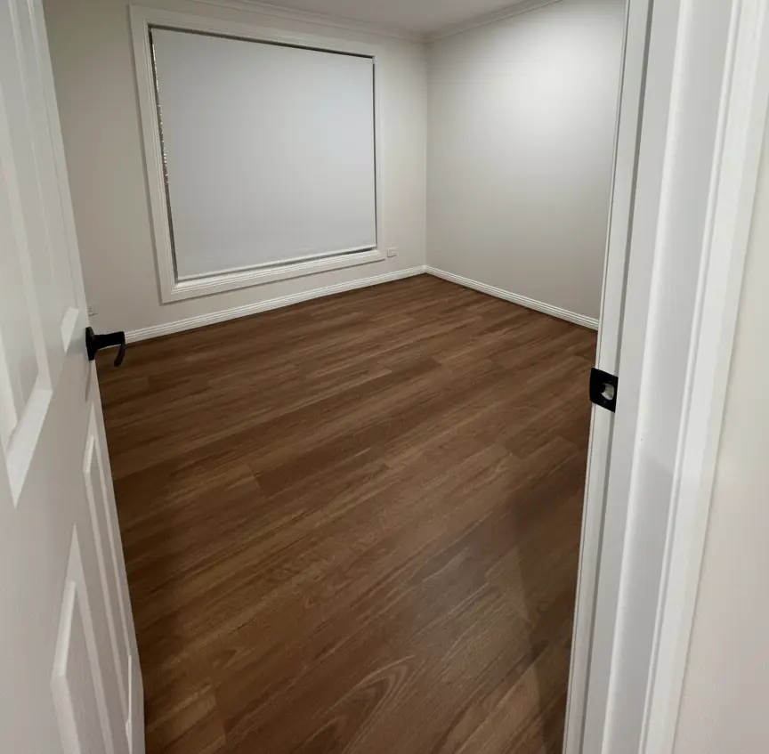 Hallway view highlighting the seamless hybrid flooring installation