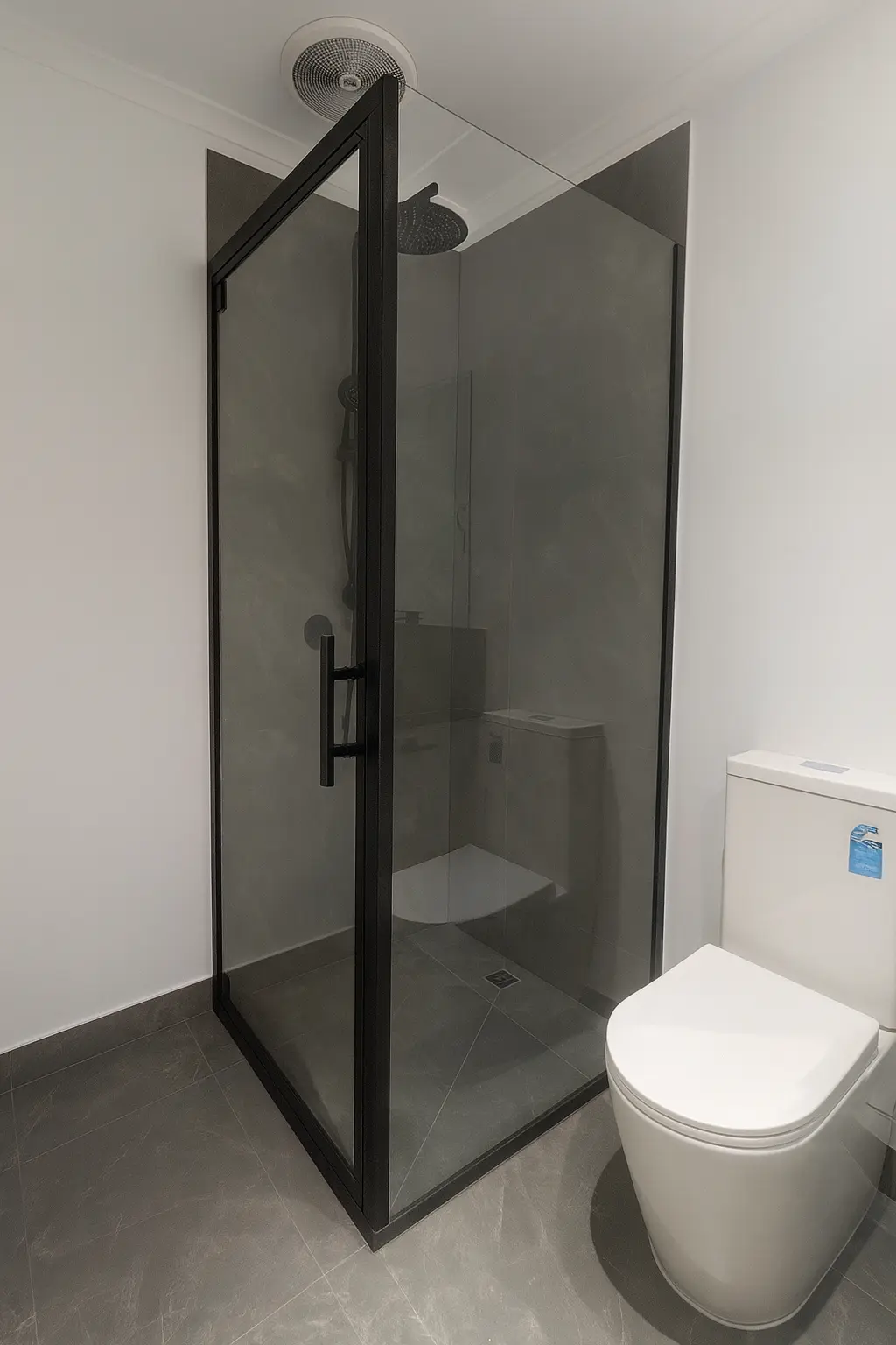 Cheap bathroom renovation solution with P3 slip-rated floor tiles and black fixtures