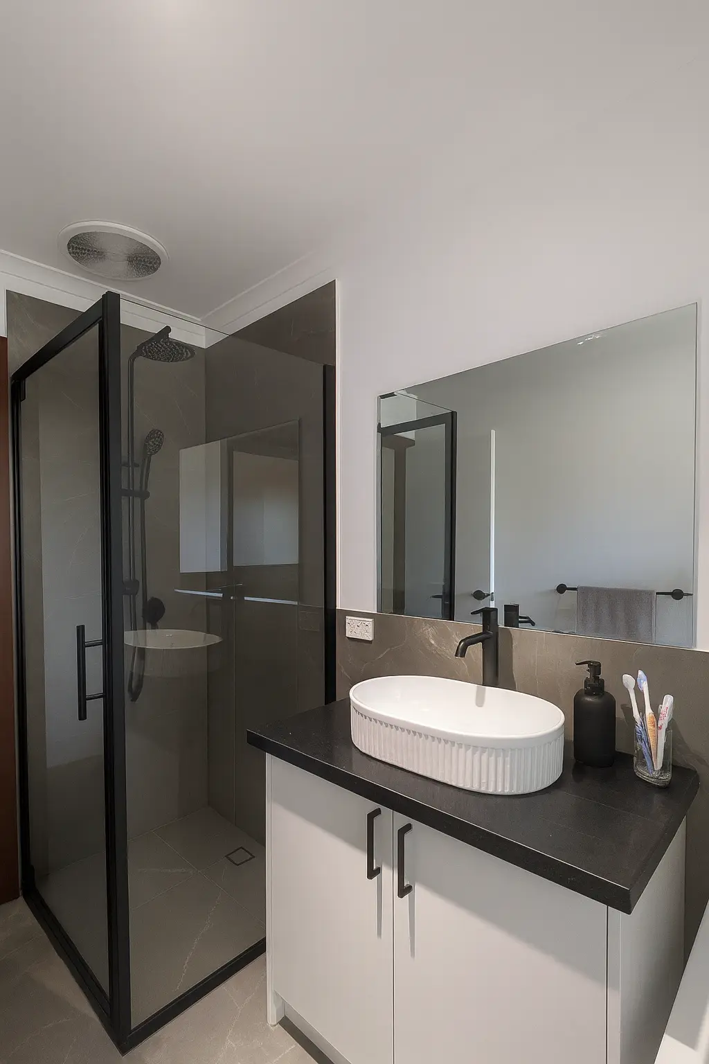 Full bathroom transformation with tiling, plumbing, electrical and painting