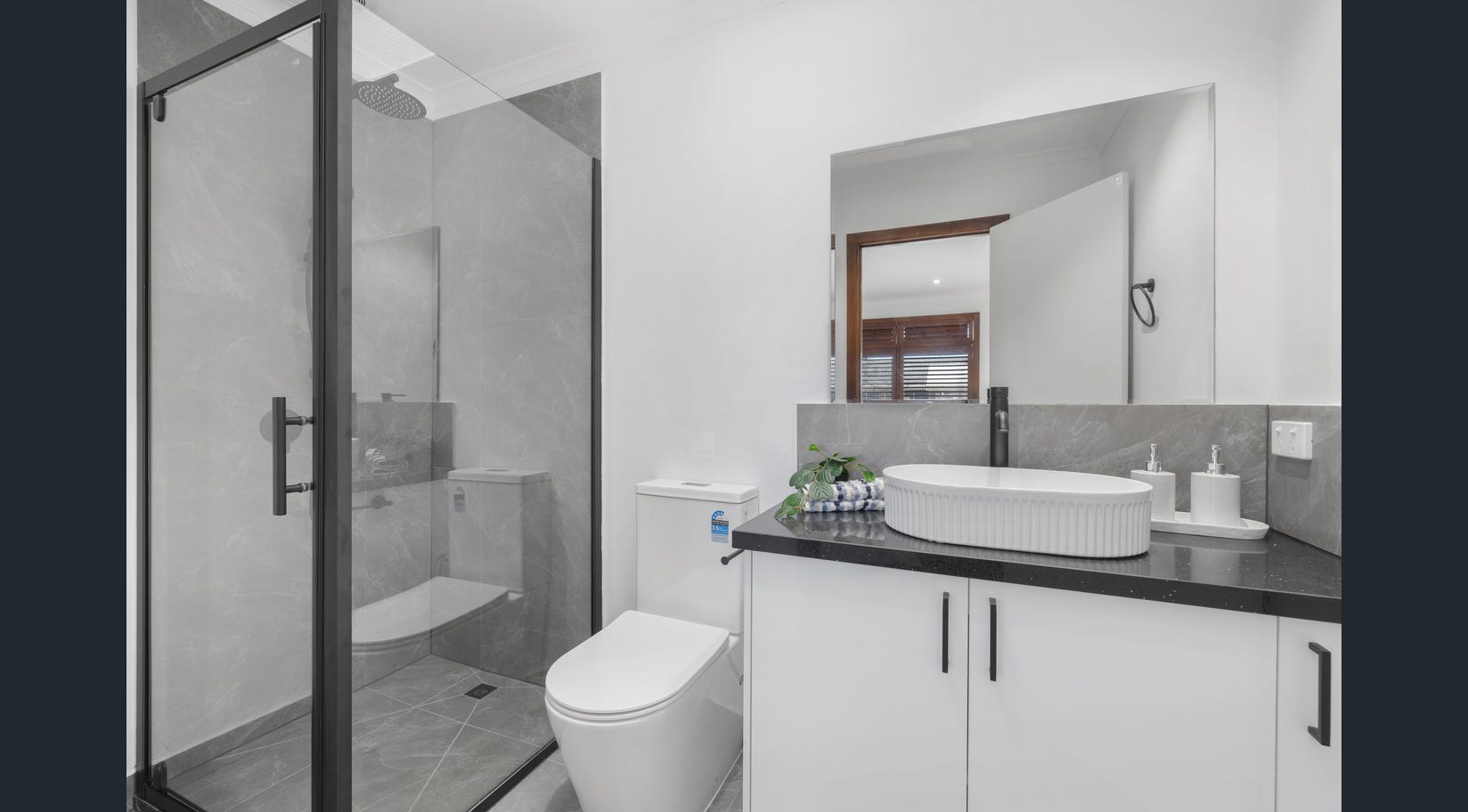Affordable bathroom remodel Melbourne with freestanding bath and tiled shower