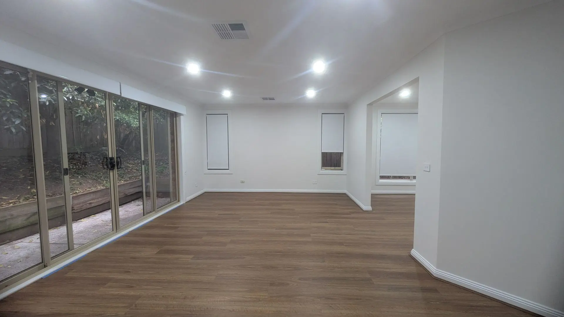 modern downlighting in full home renovation showcasing upgraded flooring, freshly painted interiors, complete electrical rewiring