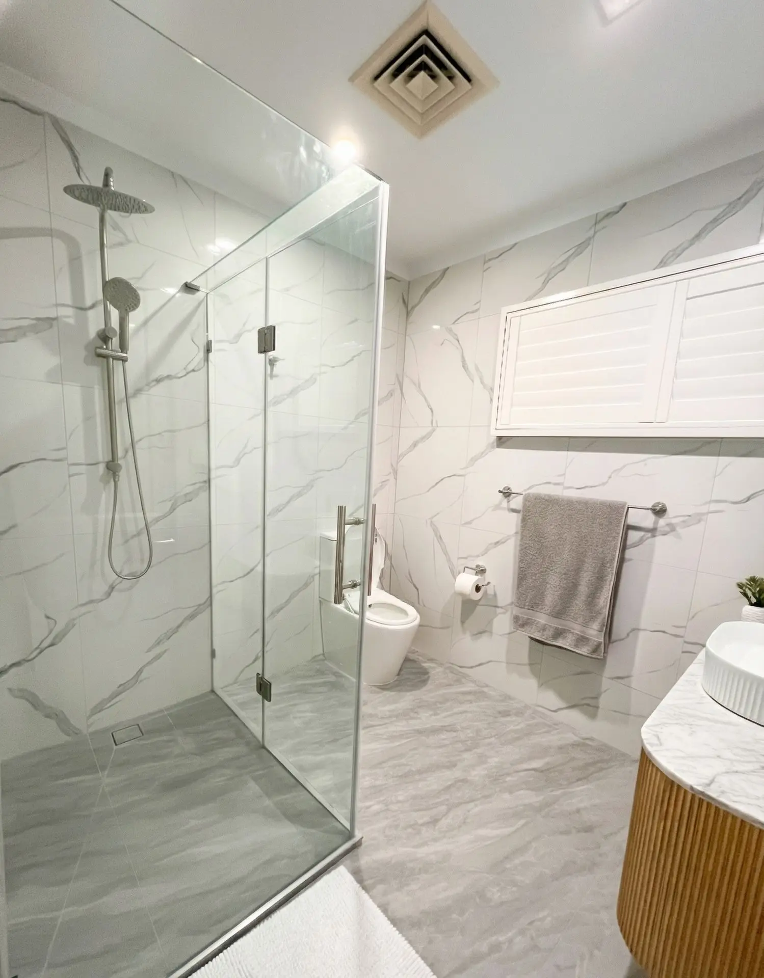 Quick bathroom makeover featuring smart toilet installation and modern fixtures.