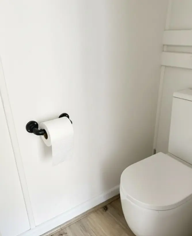 Cheap toilet renovation in Victoria with updated plumbing and tiling.