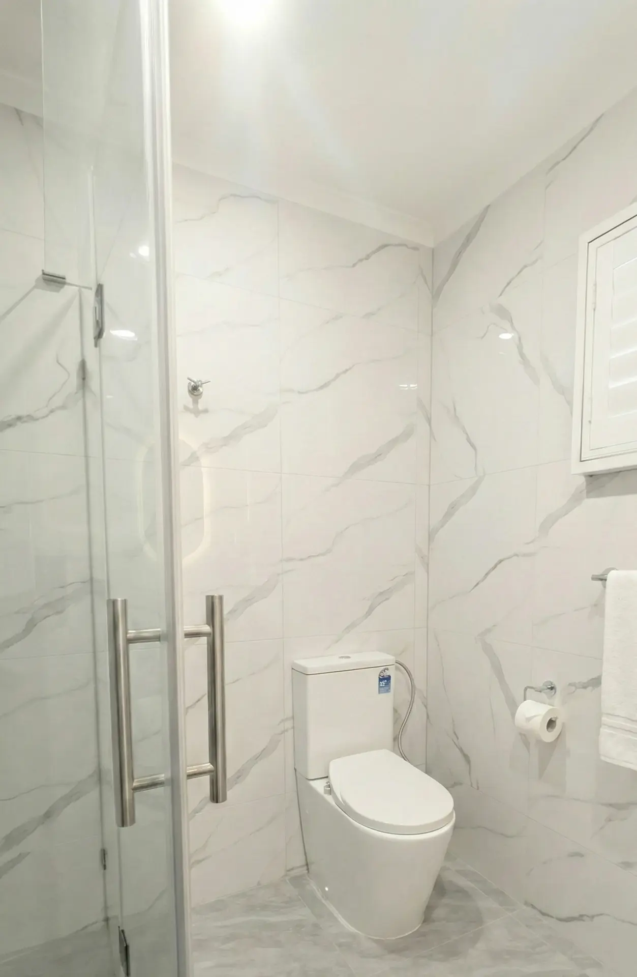 Budget-friendly bathroom renovation Melbourne featuring smart toilet and new layout.
