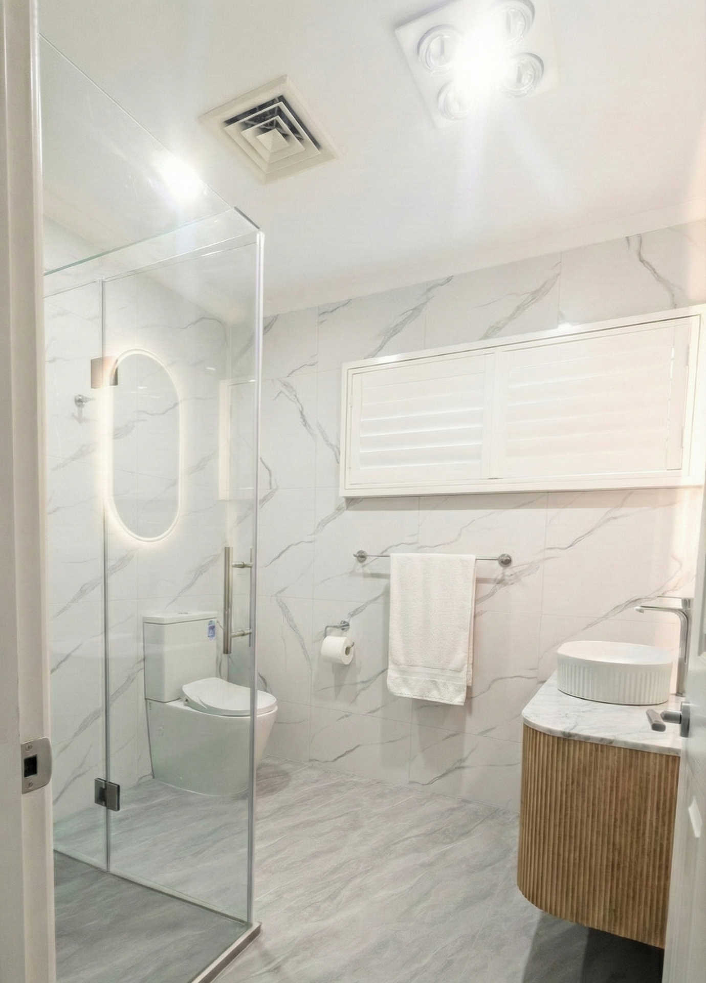 Professional bathroom renovation including tiling, plumbing, and cabinetry work.