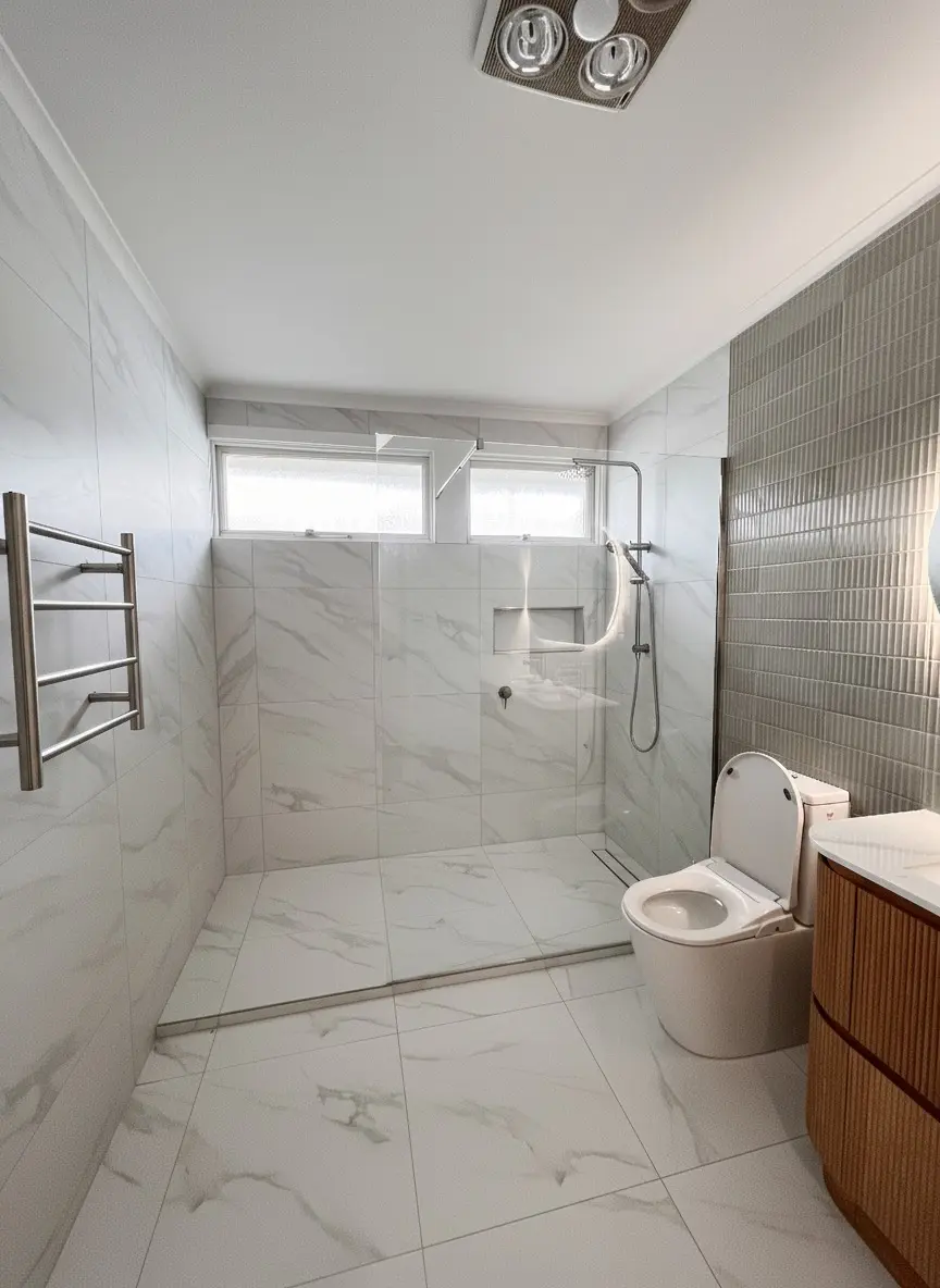 Residential bathroom renovation with wall hung toilet and timber cabinetry